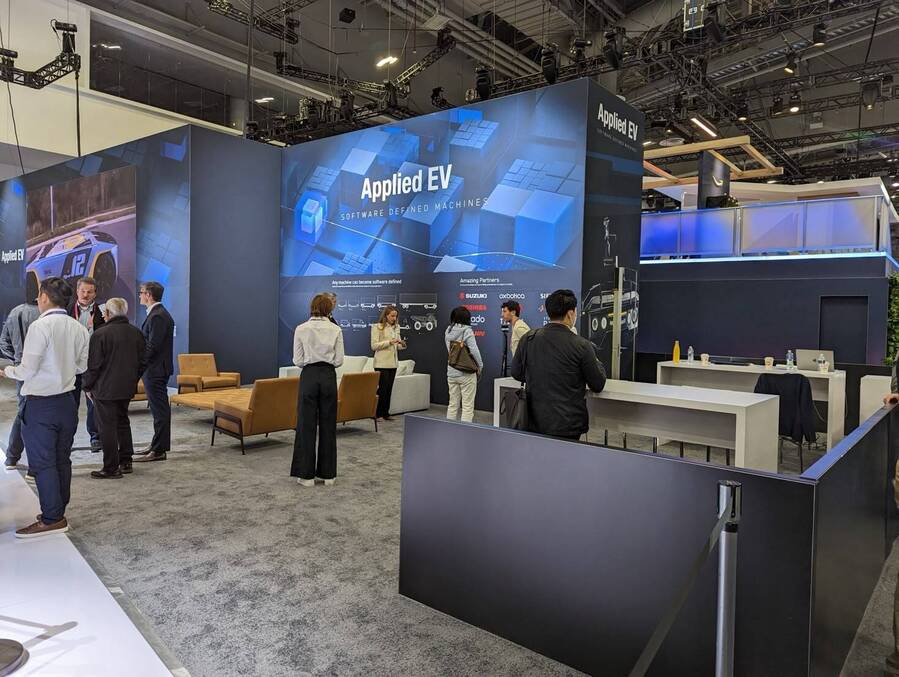 Lounge and meeting area inside Applied EV's CES 2023 booth