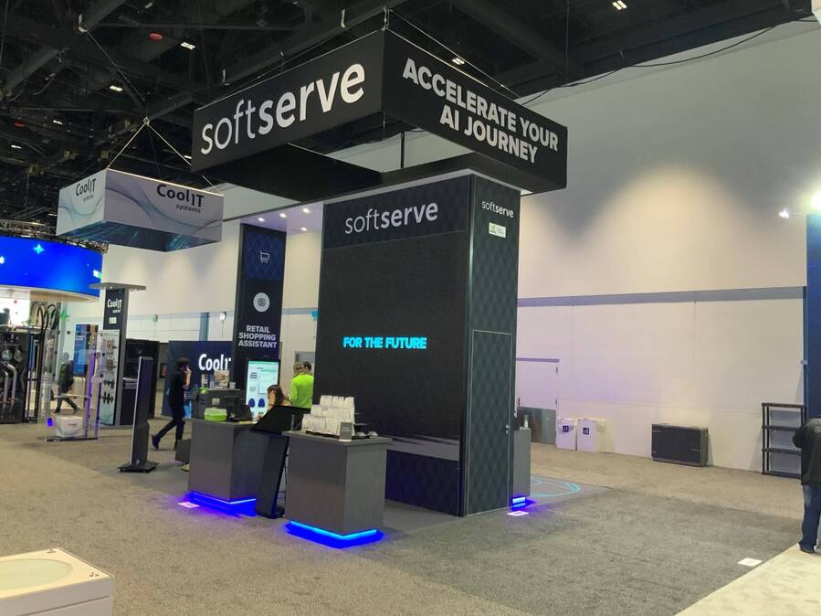 SoftServe's GTC booth from the aisle, with lit counter bases