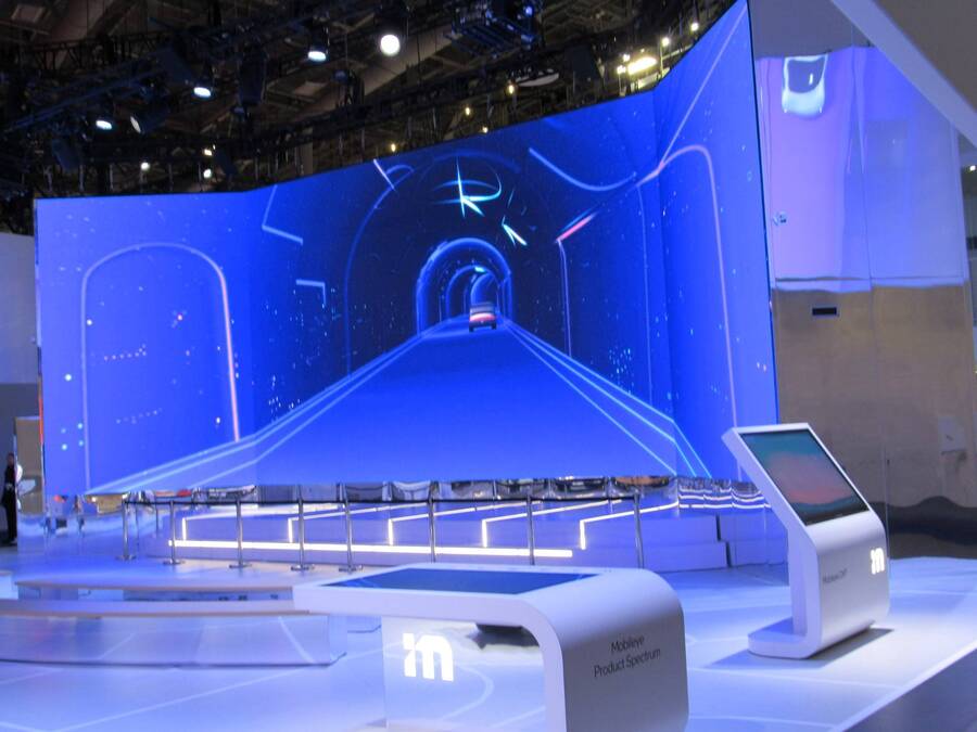 LED video wall and demo kiosk inside Mobileye's CES 2024 booth