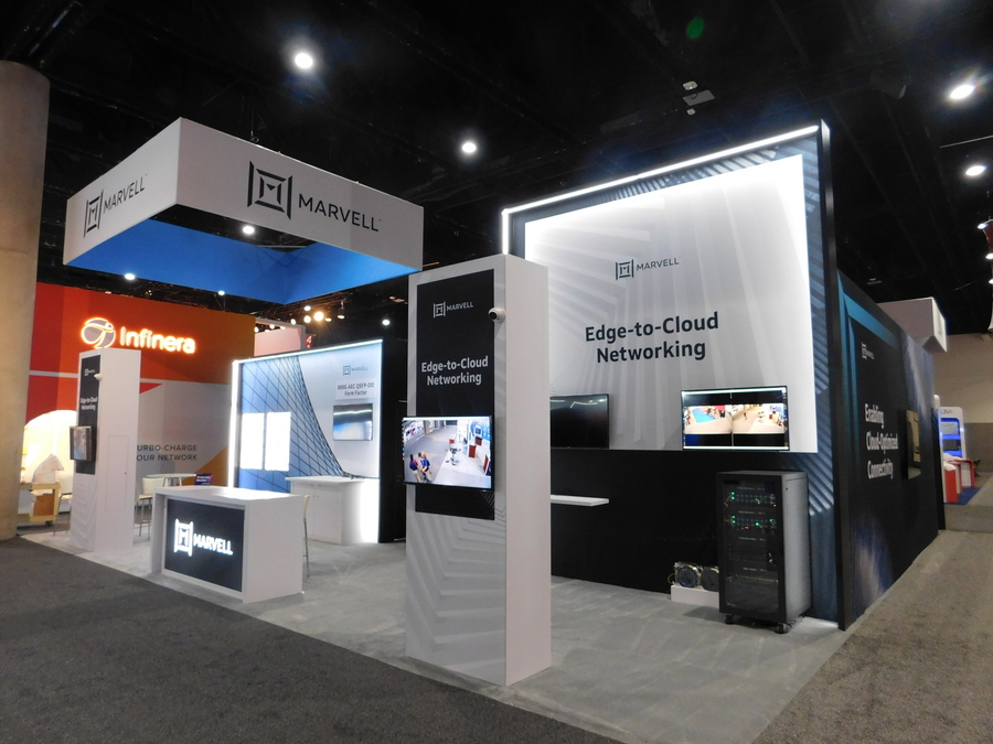 Marvell's 40x40 island booth at OFC with lit Edge-to-Cloud Networking graphics