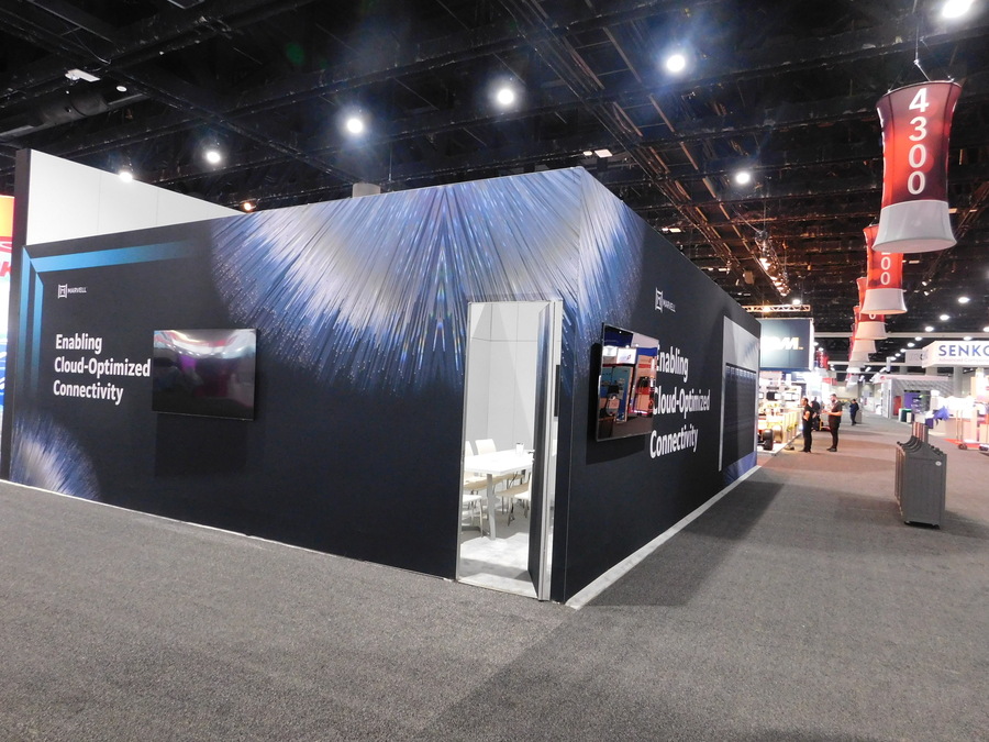 Marvell's OFC booth exterior with a blue fiber-light graphic wall